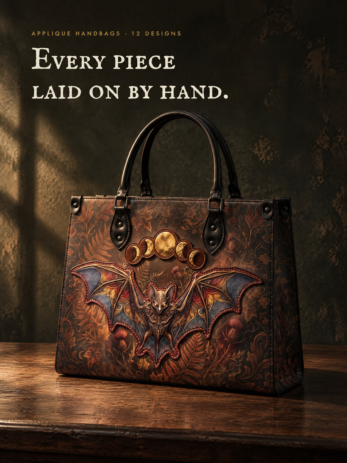 Every piece laid on by hand. The Vespertine applique handbag with a raised bat and gold moons, each piece stitched at the edge.